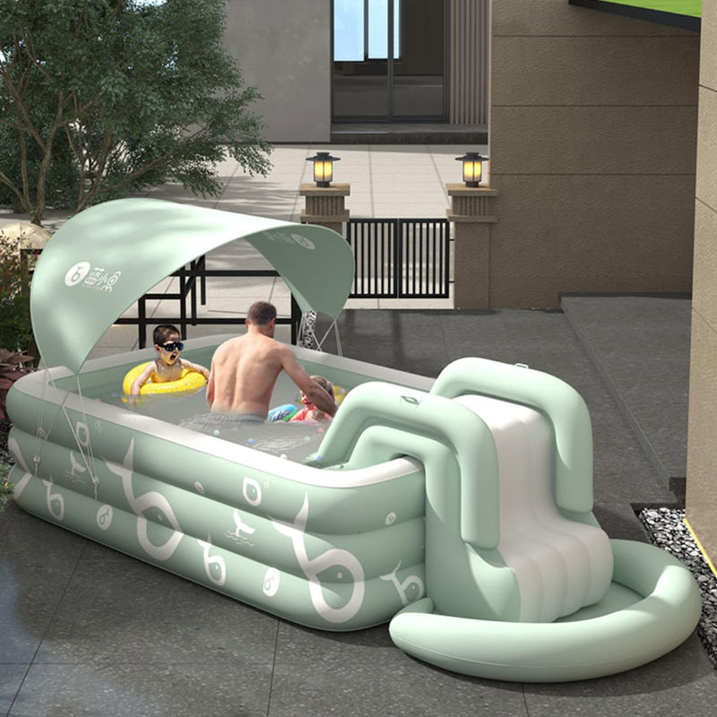 Ergocar shaded summer swimming pool. The outdoor inflatable swimming pool has a built-in slide. Above ground swimming pools for children and adults. Family entertainment leisure swimming pool.